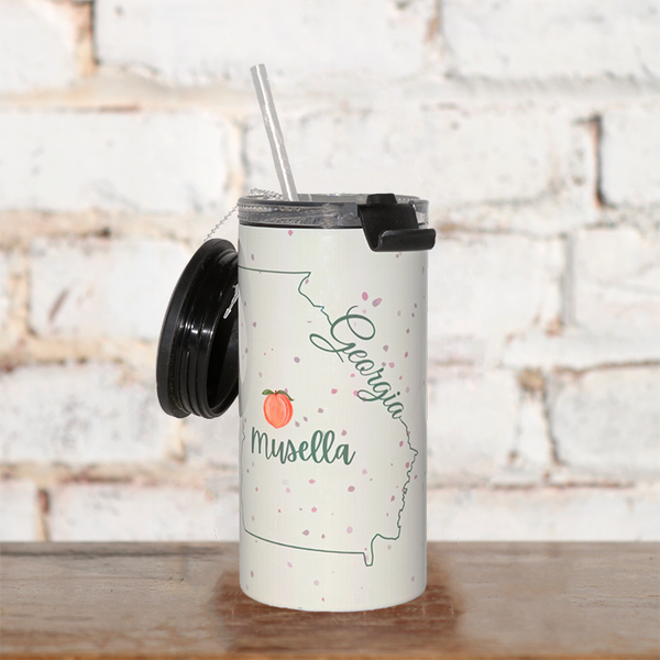 a georgia mug with a straw and a peach on it