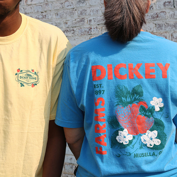 a man and a woman wearing dickey farms t-shirts