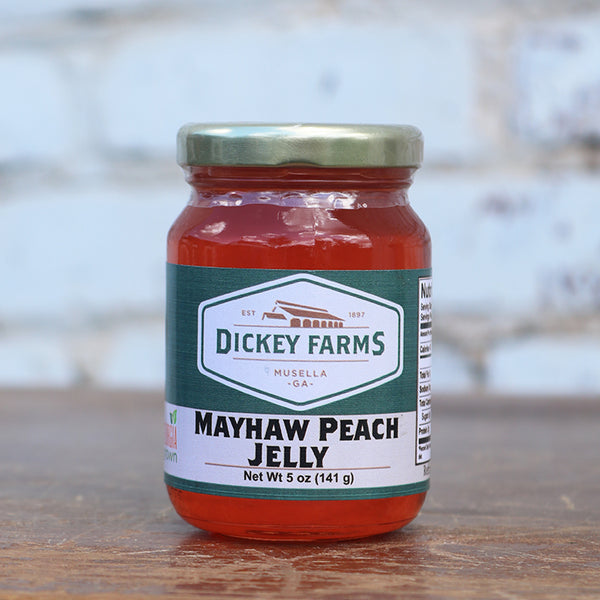a jar of mayhaw peach jelly from dickey farms