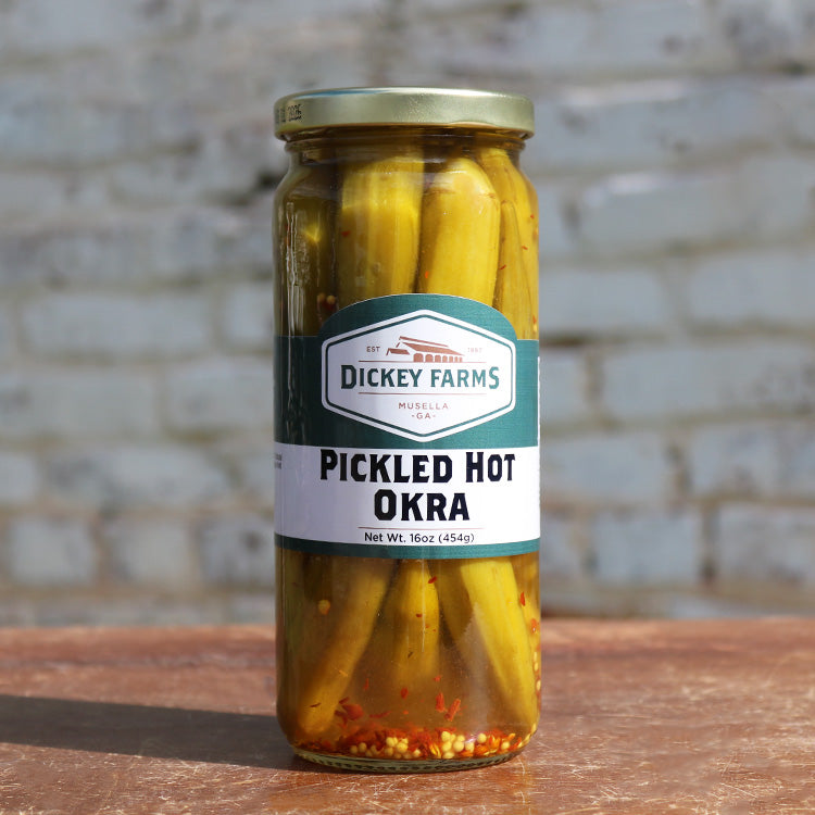 a jar of pickled hot okra from dickey farms