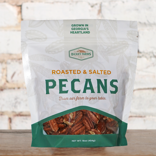 a bag of pecans is sitting on a wooden table .