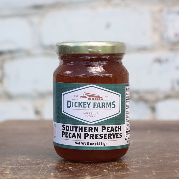 a jar of dickey farms southern peach pecan preserves